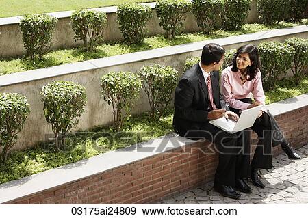 business associates working outside, laptop computer View Large Photo Image Stock Photo - business associates working outside, laptop computer. Fotosearch