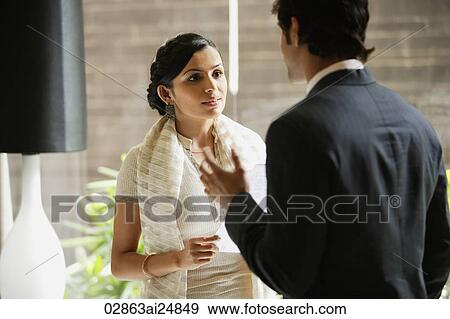 Stock Photo - business colleagues in discussion. Fotosearch