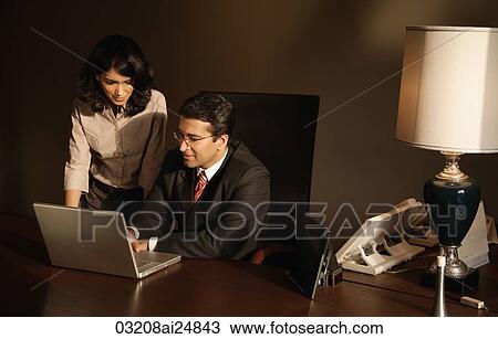 business colleagues working at laptop computer View Large Photo Image Stock Image - business colleagues working at laptop computer. Fotosearch