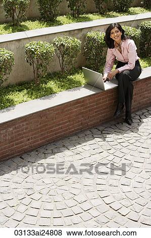 business woman working outside, laptop computer View Large Photo Image Stock Photo - business woman working outside, laptop computer. Fotosearch