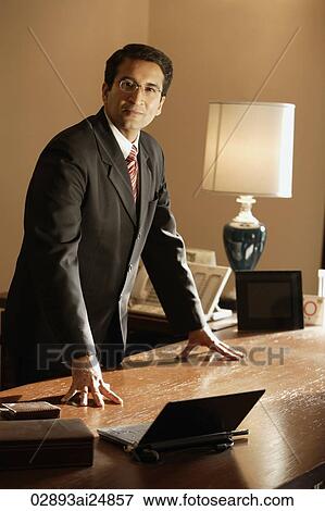 businessman at desk View Large Photo Image Stock Photo - businessman at desk. Fotosearch