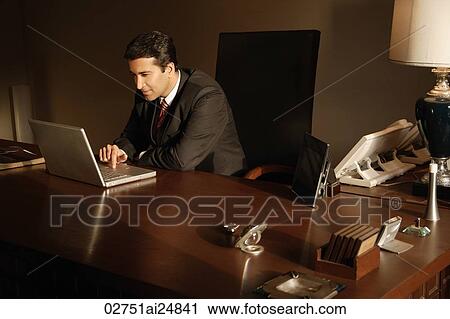 Stock Image - businessman on laptop computer. Fotosearch