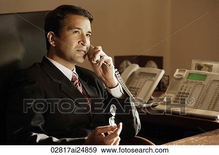 businessman on phone, in office View Large Photo Image Stock Photo - businessman on phone, in office. Fotosearch