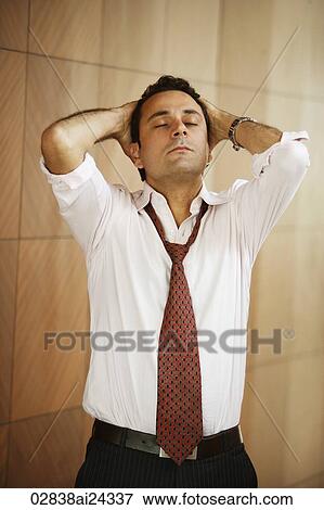 Stock Photo - businessman with hands on head. Fotosearch