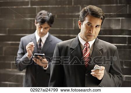 Stock Photo - businessmen, mobile phone. Fotosearch