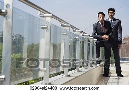 businessmen standing on balcony View Large Photo Image Stock Photo - businessmen standing on balcony. Fotosearch