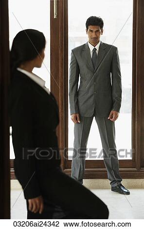 Businesswoman looking at businessman View Large Photo Image Stock Image - Businesswoman looking at businessman. Fotosearch