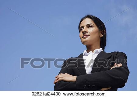 Stock Image - businesswoman with arms folded. Fotosearch
