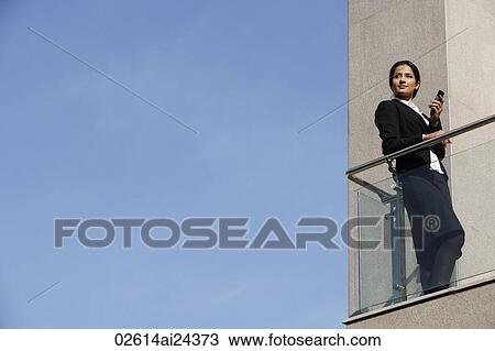 businesswoman with mobile phone, on balcony View Large Photo Image Stock Image - businesswoman with mobile phone, on balcony. Fotosearch