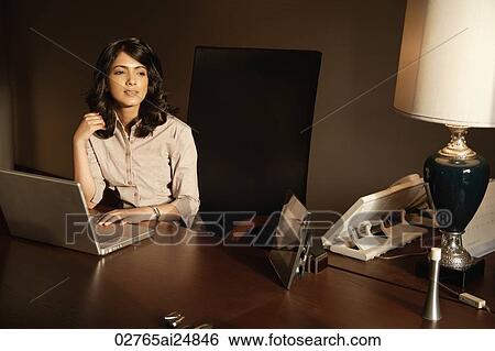 Stock Photograph - businesswoman working at laptop computer. Fotosearch