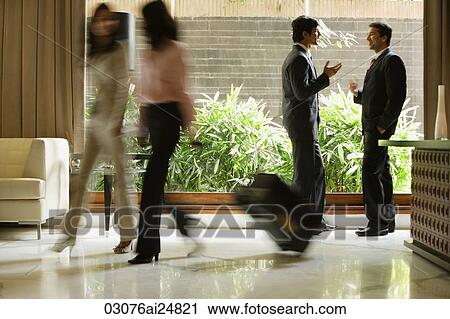 Stock Image - busy hotel lobby. Fotosearch