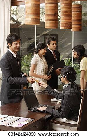 Stock Image - conference registration table. Fotosearch