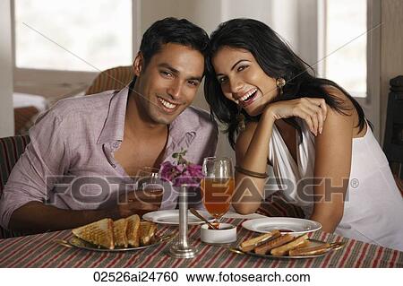 Stock Image - couple at restaurant. Fotosearch
