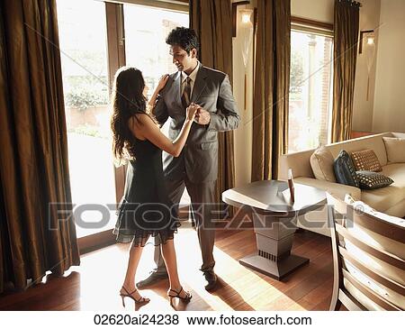 Stock Photo - couple dancing at home. Fotosearch