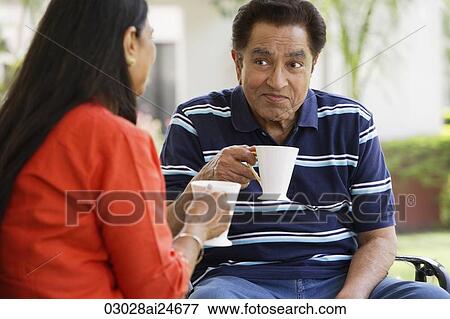 couple having beverage outside View Large Photo Image Stock Photo - couple having beverage outside. Fotosearch