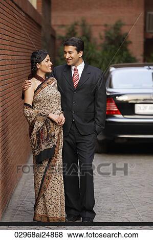 couple in front of car, woman in sari View Large Photo Image Stock Photo - couple in front of car, woman in sari. Fotosearch