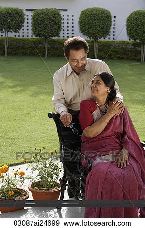 couple outdoors, woman wearing sari View Large Photo Image Stock Photo - couple outdoors, woman wearing sari. Fotosearch