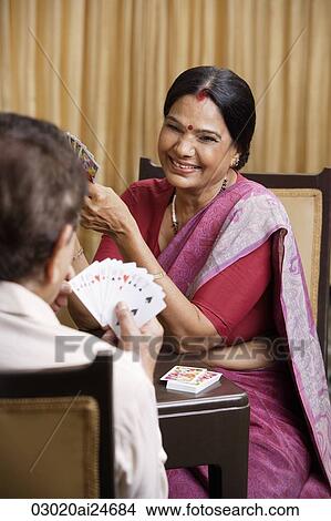 couple playing cards, woman wearing sari and bindi View Large Photo Image Picture - couple playing cards, woman wearing sari and bindi. Fotosearch