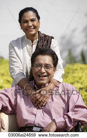 couple posing for portrait outside, woman wearing salwar kameez and shawl View Large Photo Image Stock Photo - couple posing for portrait outside, woman wearing salwar kameez and shawl. Fotosearch