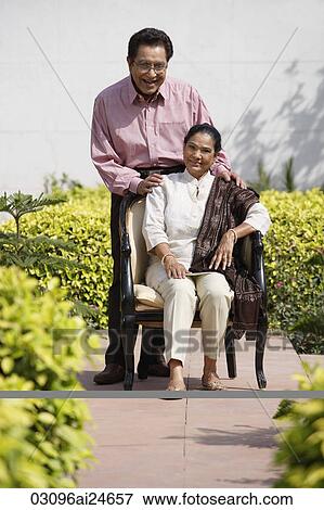 couple posing for portrait outside, woman wearing salwar kameez and shawl View Large Photo Image Stock Photo - couple posing for portrait outside, woman wearing salwar kameez and shawl. Fotosearch