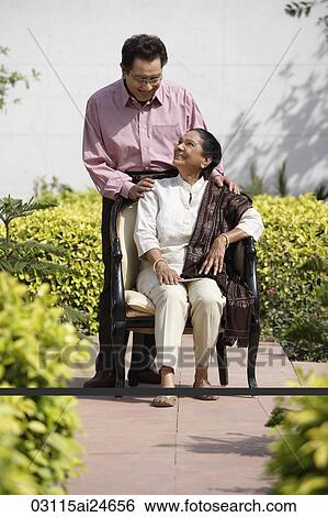 couple posing for portrait outside, woman wearing salwar kameez and shawl View Large Photo Image Stock Photograph - couple posing for portrait outside, woman wearing salwar kameez and shawl. Fotosearch
