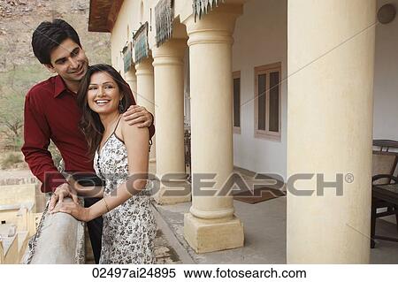 Stock Photography - couple resting on fence. Fotosearch