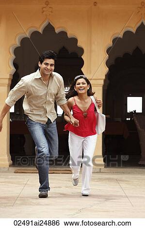 Stock Photograph - couple running. Fotosearch