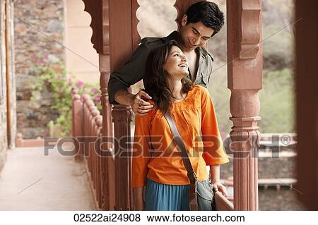 Stock Photo - couple standing on balcony. Fotosearch