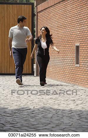 Stock Photography - couple walking in exercise clothes. Fotosearch