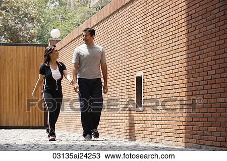 couple walking in exercise clothing View Large Photo Image Stock Image - couple walking in exercise clothing. Fotosearch
