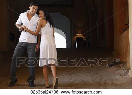 couple wearing white, smiling View Large Photo Image Stock Photograph - couple wearing white, smiling. Fotosearch
