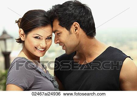 flirtatious couple View Large Photo Image Stock Photograph - flirtatious couple. Fotosearch