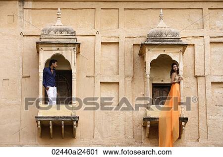 man and woman on balconies, woman in sari View Large Photo Image Stock Image - man and woman on balconies, woman in sari. Fotosearch