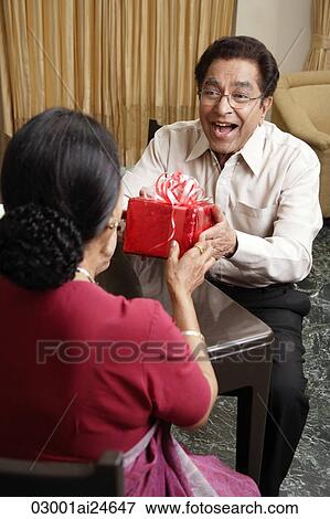 man giving woman a gift View Large Photo Image Stock Photo - man giving woman a gift. Fotosearch