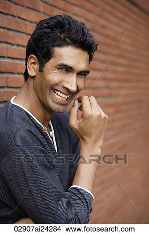 Picture - man laughing. Fotosearch