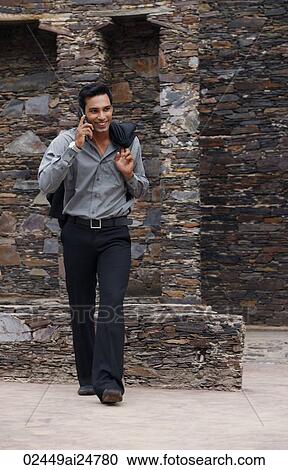 Stock Image - man on mobile phone. Fotosearch