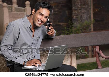 man on phone, with laptop computer View Large Photo Image Stock Photography - man on phone, with laptop computer. Fotosearch