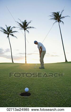 man playing golf during sunset View Large Photo Image Stock Photography - man playing golf during sunset. Fotosearch