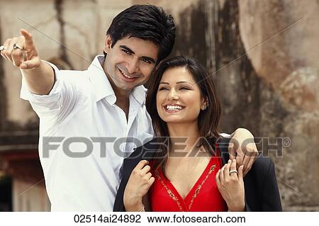 man pointing out something to woman View Large Photo Image Stock Image - man pointing out something to woman. Fotosearch