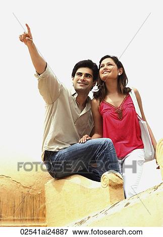 man pointing out something to woman View Large Photo Image Stock Photo - man pointing out something to woman. Fotosearch