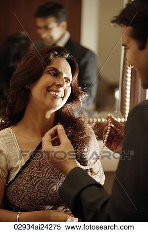 man presenting pearls to woman View Large Photo Image Stock Photography - man presenting pearls to woman. Fotosearch