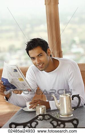 man reading morning newspaper, having hot drink View Large Photo Image Stock Image - man reading morning newspaper, having hot drink. Fotosearch