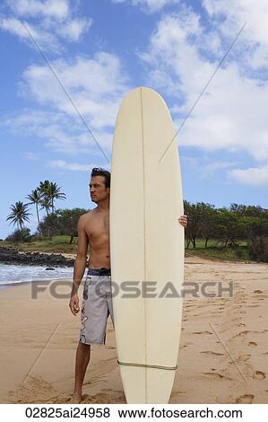 man standing on beach with surf board View Large Photo Image Stock Photo - man standing on beach with surf board. Fotosearch
