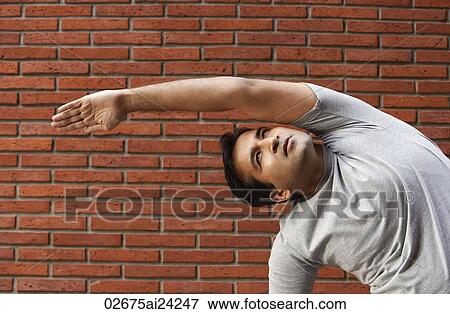 Stock Photo - man stretching. Fotosearch