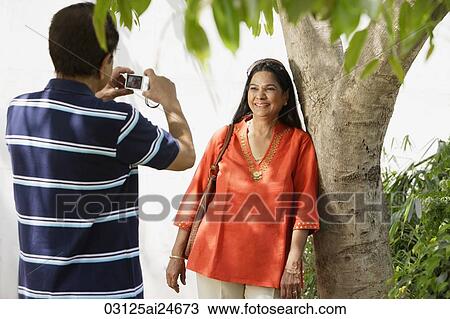 man taking photograph of woman View Large Photo Image Stock Image - man taking photograph of woman. Fotosearch