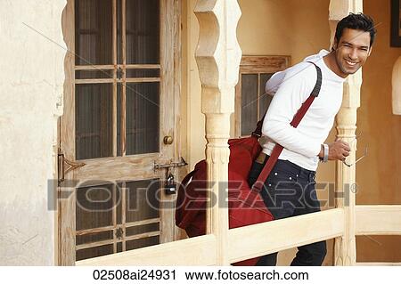 Stock Image - man with duffel bag. Fotosearch