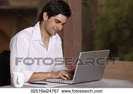 man working at laptop computer View Large Photo Image Stock Photo - man working at laptop computer. Fotosearch