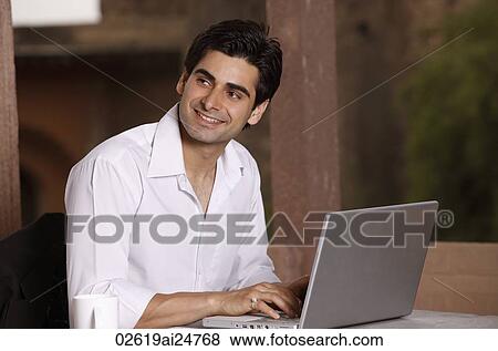 man working at laptop computer View Large Photo Image Stock Photo - man working at laptop computer. Fotosearch