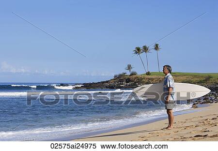 mature man holding surf board View Large Photo Image Stock Photography - mature man holding surf board. Fotosearch
