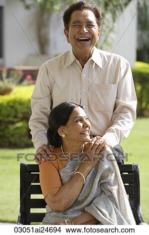 Picture - portrait of couple outside, woman in sari and bindi. Fotosearch